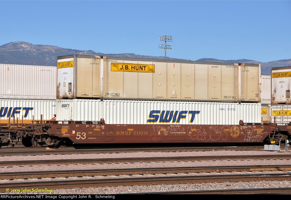 BNSF 211010-A with JB HUNT and SWIFT containers at San Bernardino CA.  10/31/2009